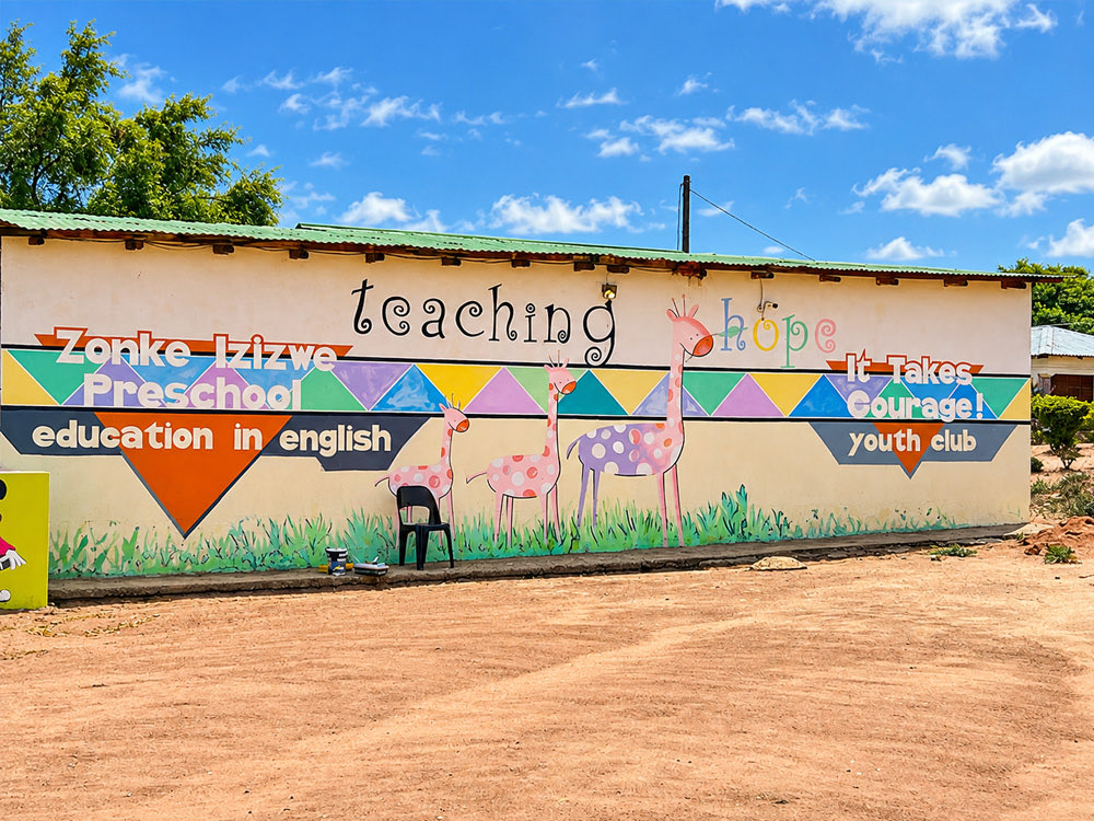 The school building painted with the words teaching hope and Zonke Izizwe Preschool